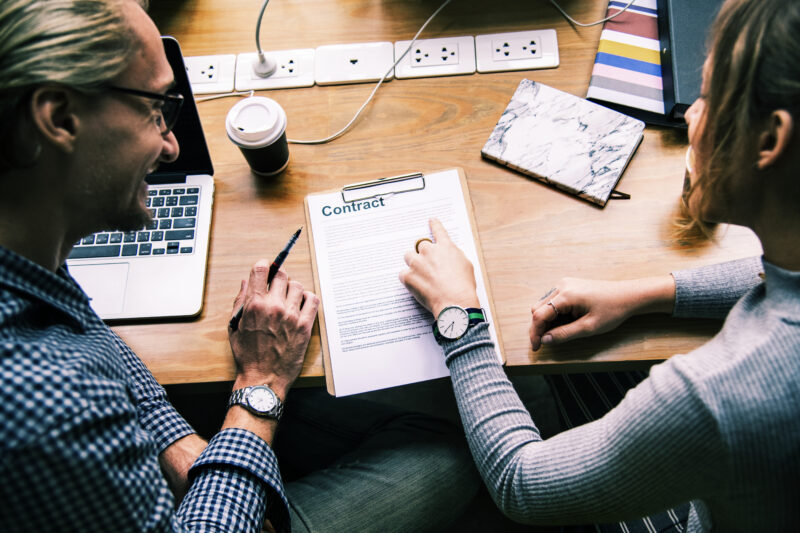 business-people-discussing-contract